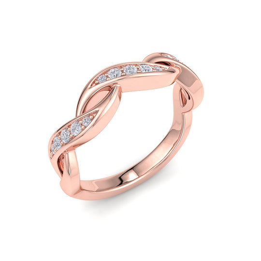 Twisted ring in yellow gold with white diamonds of 0.15 ct in weight