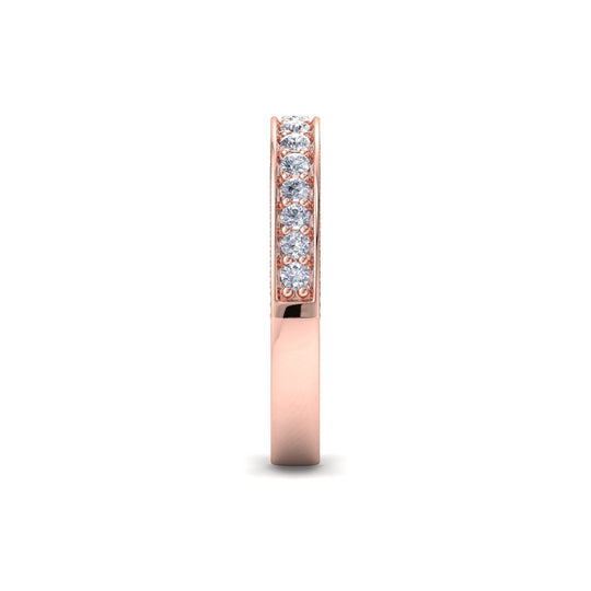 Petite channel set ring in yellow gold with white diamonds of .042 ct in weight