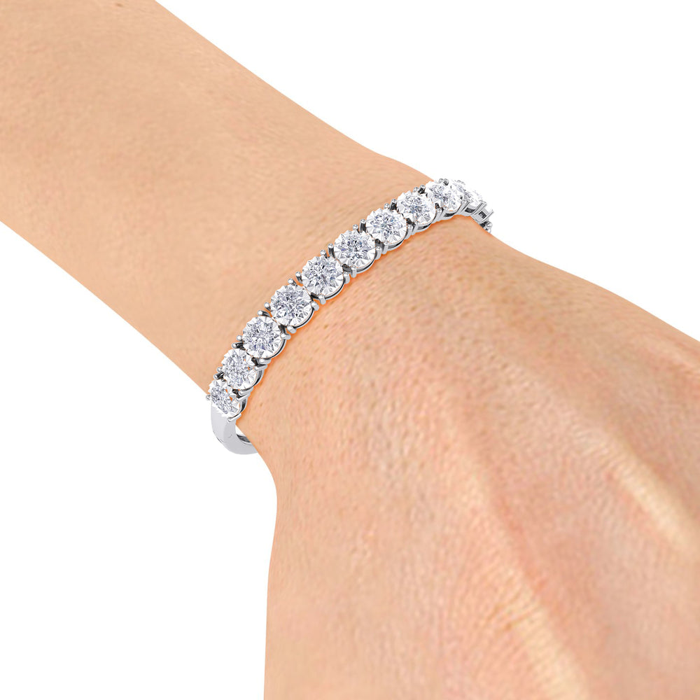 Bangle in white gold with white diamonds of 3.30 ct in weight with miracle plate setting
