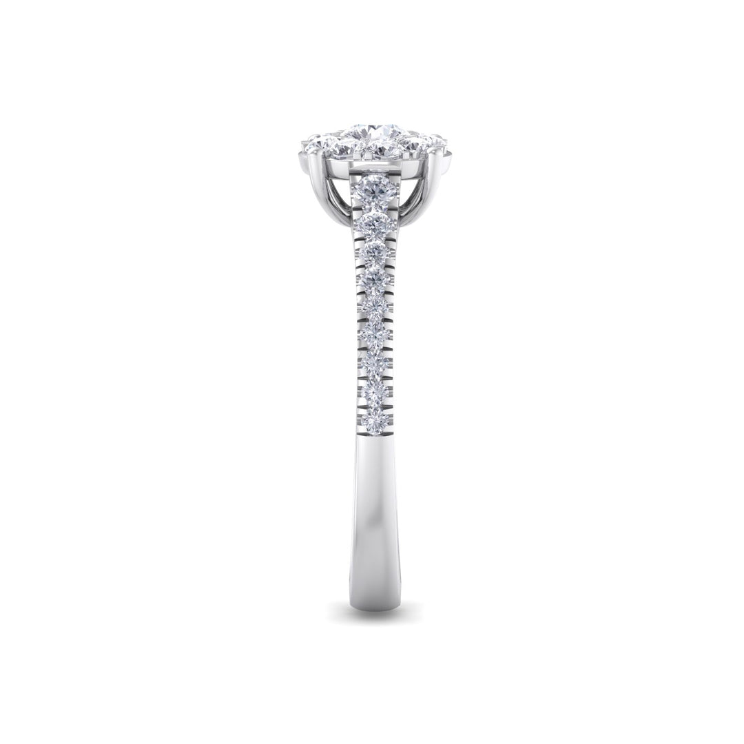Halo engagement ring with pavé band in white gold with white diamonds of 0.56 ct in weight
