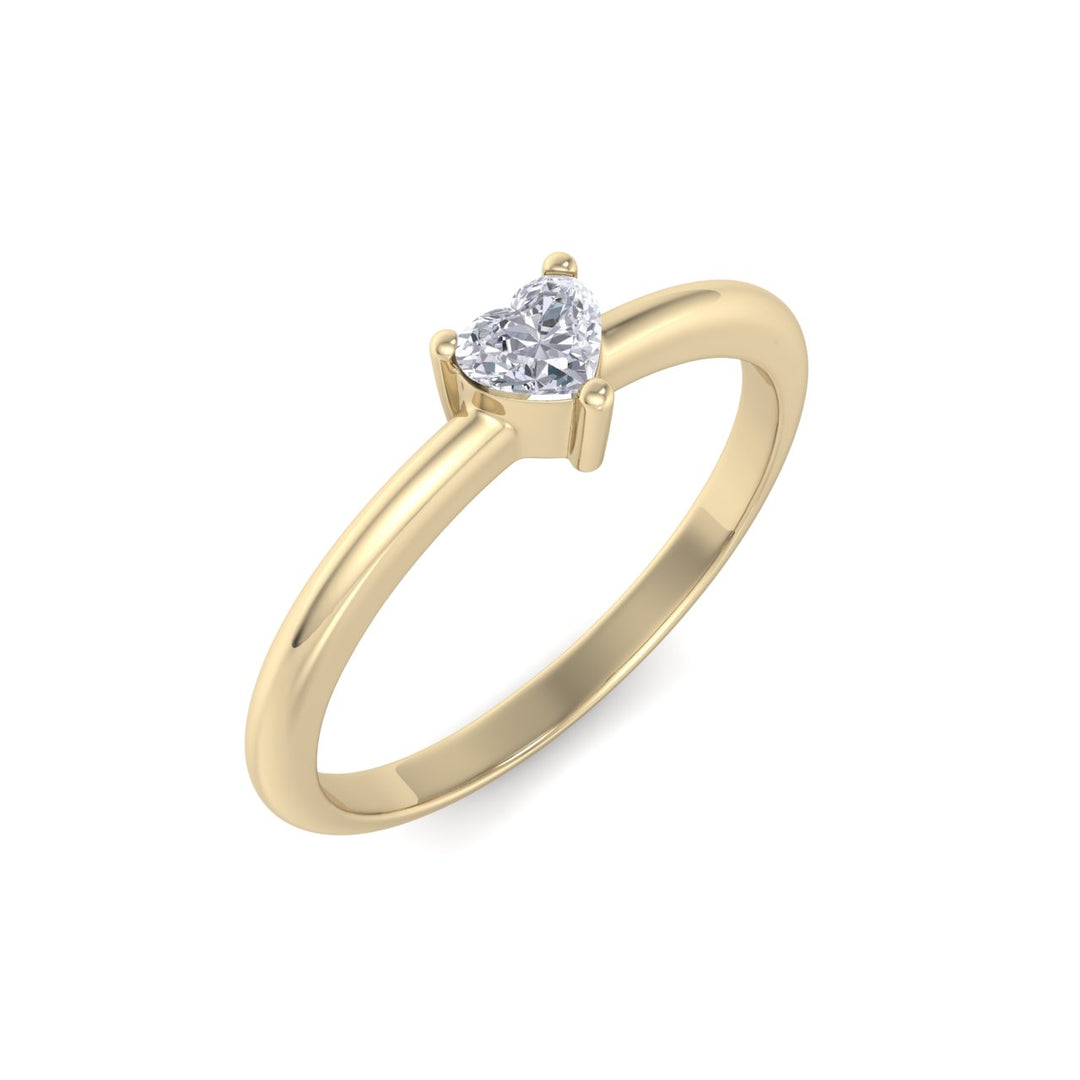 Heart shaped petite diamond ring in yellow gold with white diamonds of 0.25 ct in weight